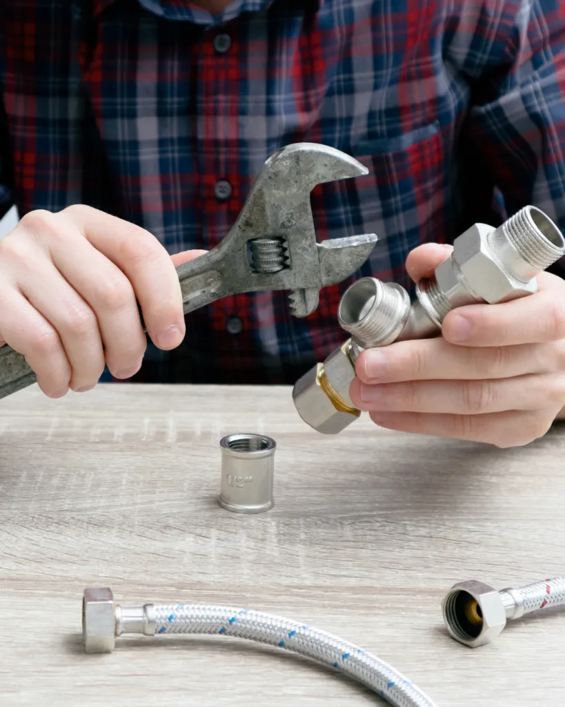 plumber holding tools