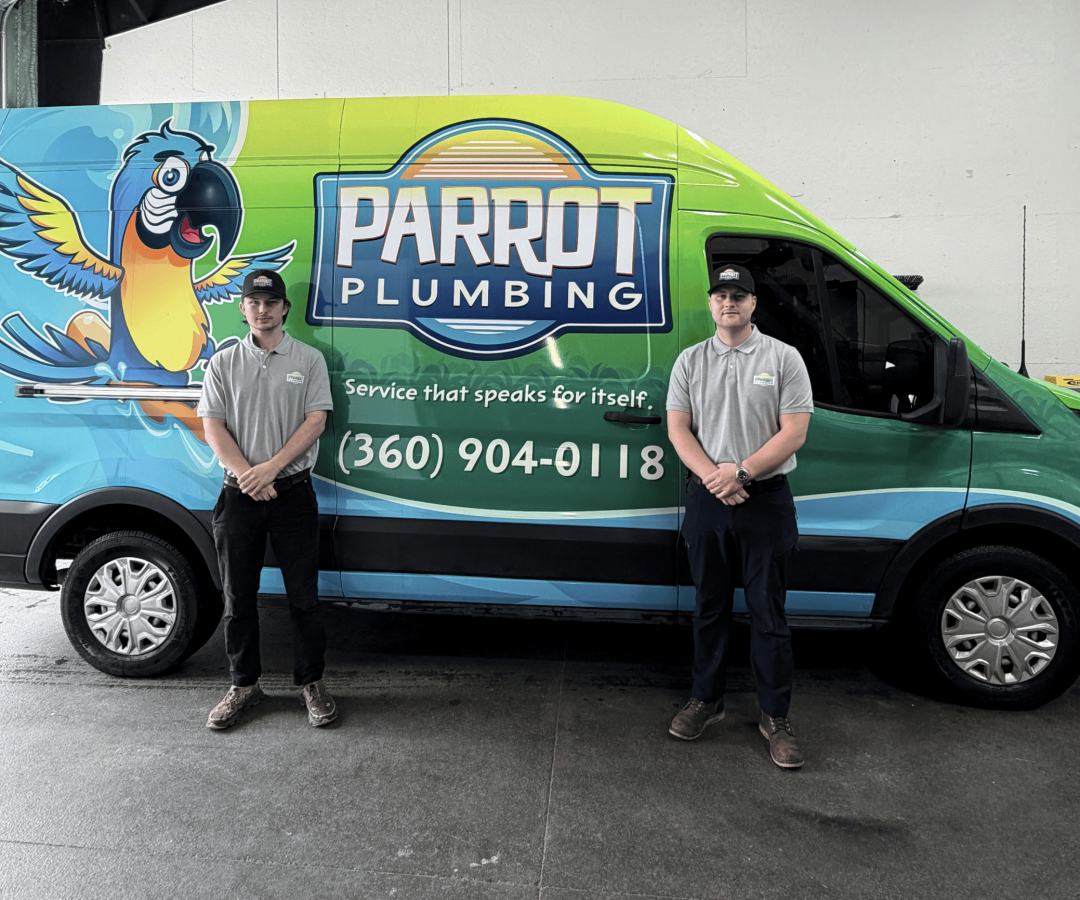 Plumbers in front of van